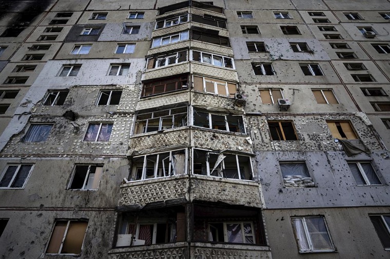A destroyed apartment building in News Online & World News