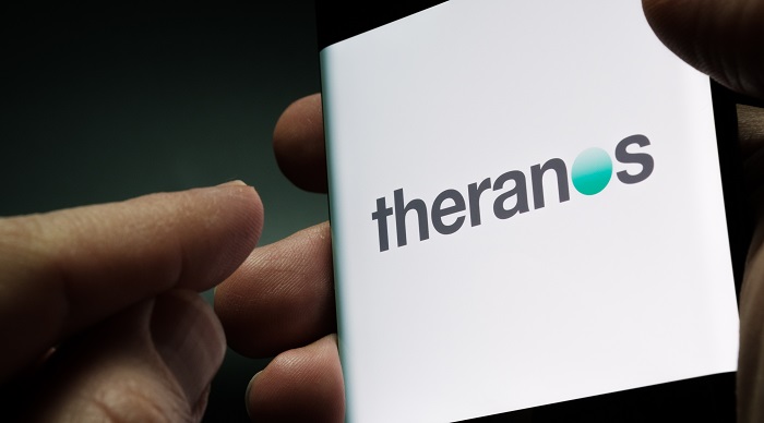 Theranos logo in headline news & online news