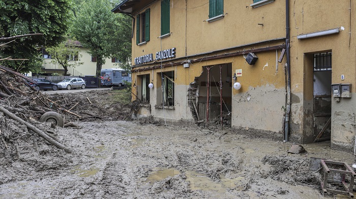 Italy's flooded areas in headline news & news online