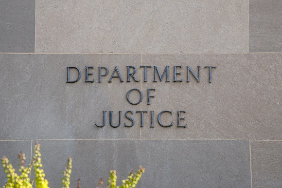 The facade of the US Department of Justice in headline news & bulleitn news