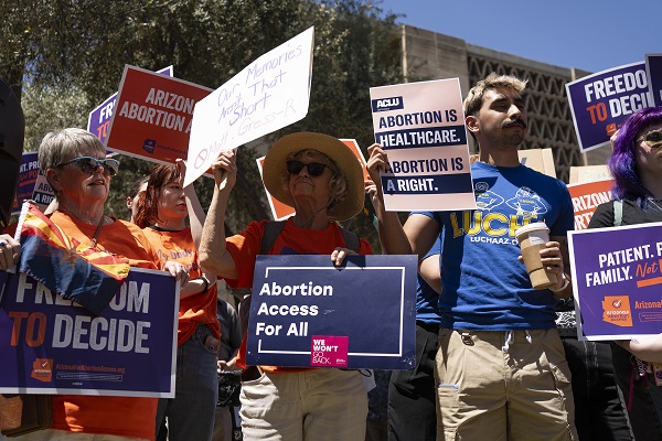 Arizona's repeal of an abortion law in headline news & online news