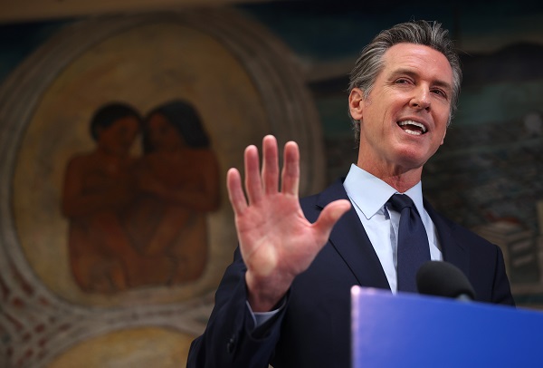 Gavin Newsom in a speech moment in headline news & online news