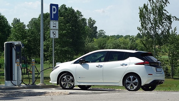 Nissan's electric car & a charging station in the economy & news online